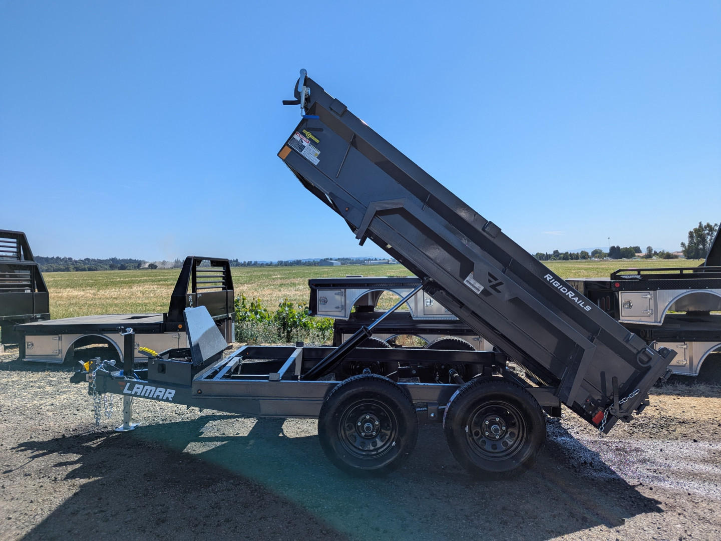 New 2026 Lamar Trailers 60" x 10' - 7K Dump Trailer 18" SIDES