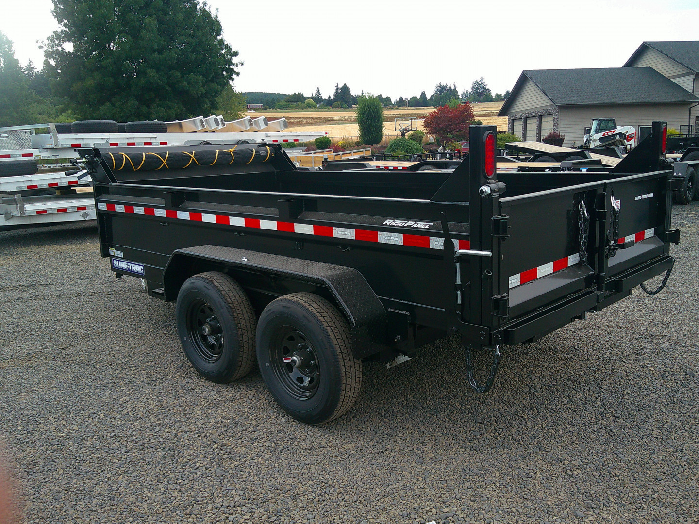New 2025 Sure-Trac 6x10 SD Low Profile 10K Dump Trailer