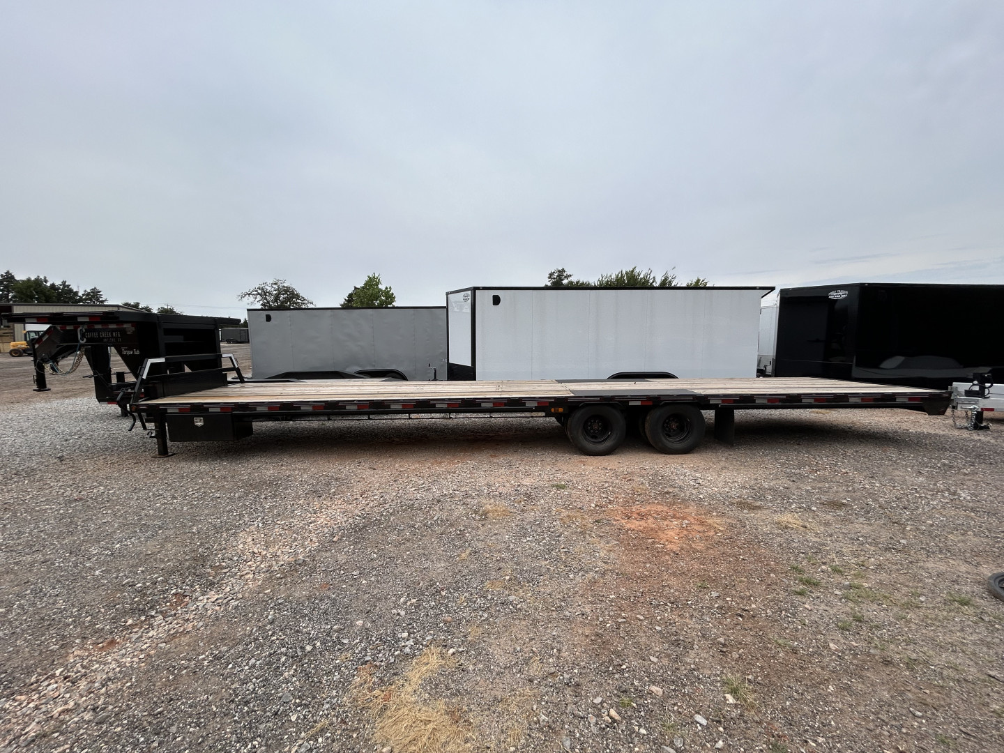 New 2025 Coffee Creek MFG GH 102”x36’ Dual Axle Deckover Trailer