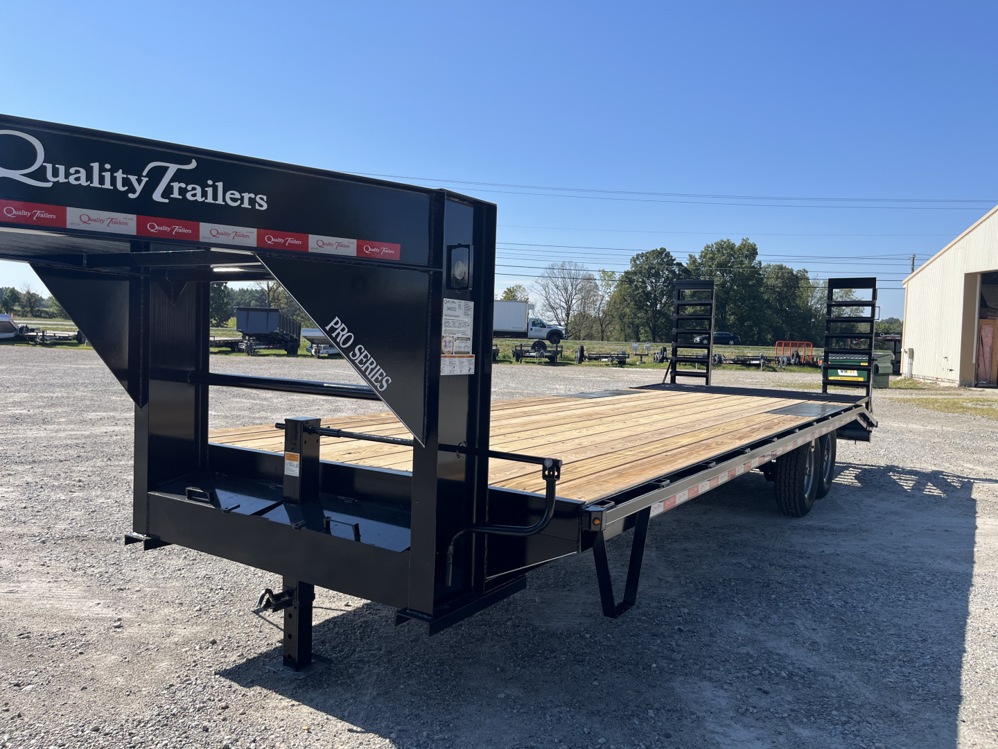 New 2026 Quality Trailers 102X24 Deckover Trailer Gooseneck 4' Pop Up Dovetail 17K GVWR