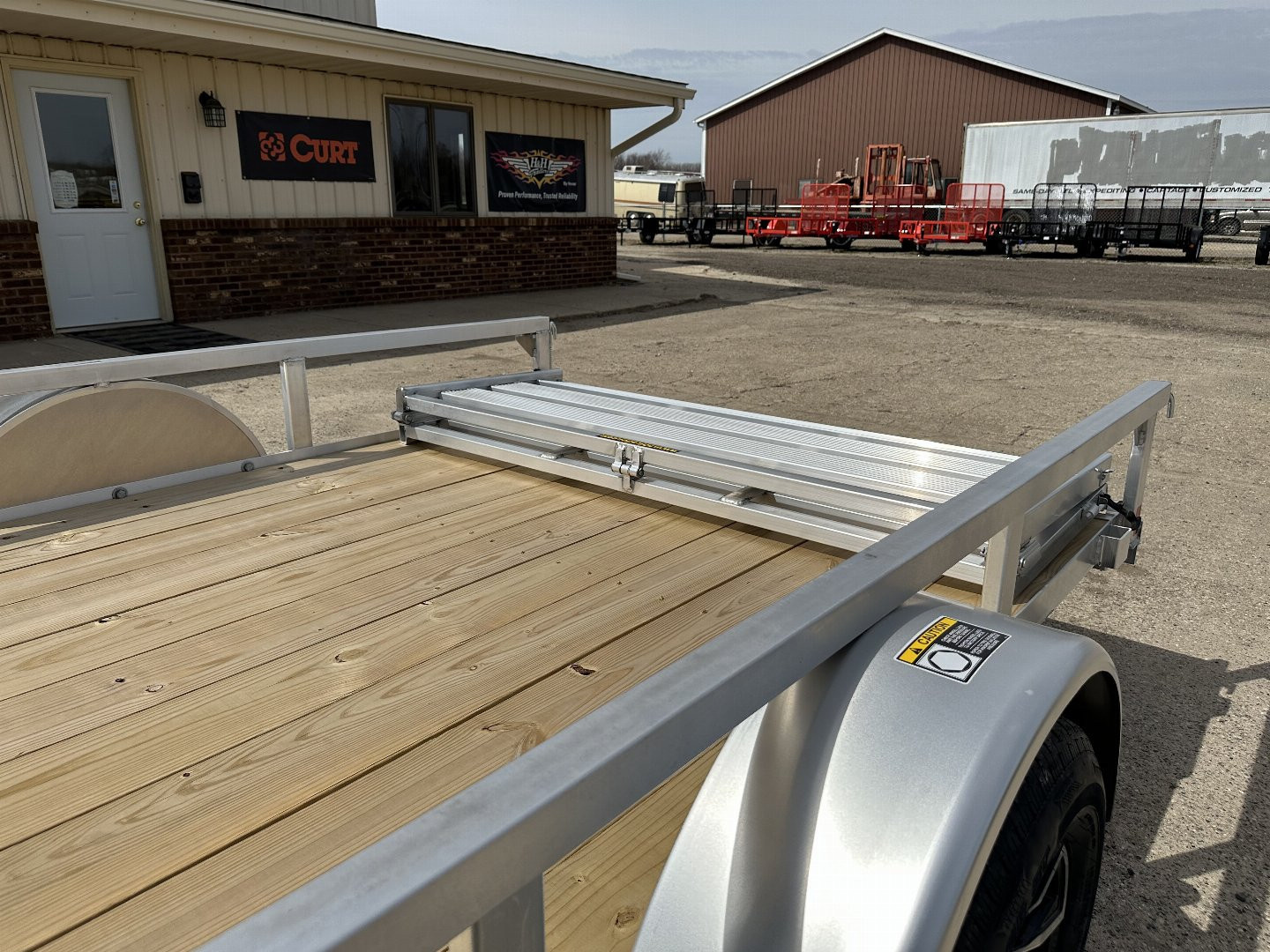 New 2025 H&H TRAILERS 76X12 Aluminum Landscape Trailer (Small Dent in Driver Fender)