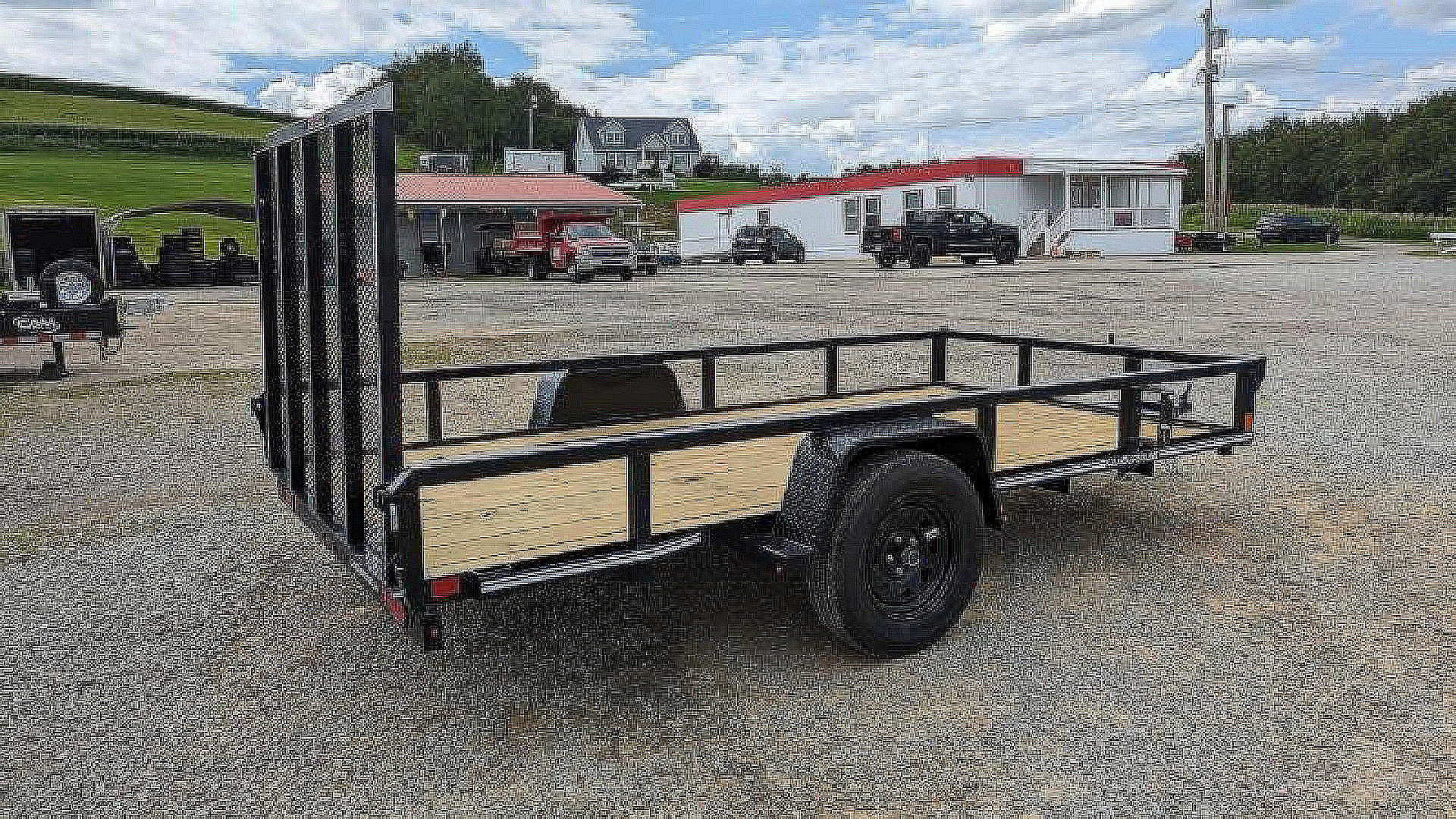 New 2025 CAM SUPERLINE 7x12 Tubular Top Rail Utility Trailer w/ Spring Assist Gate