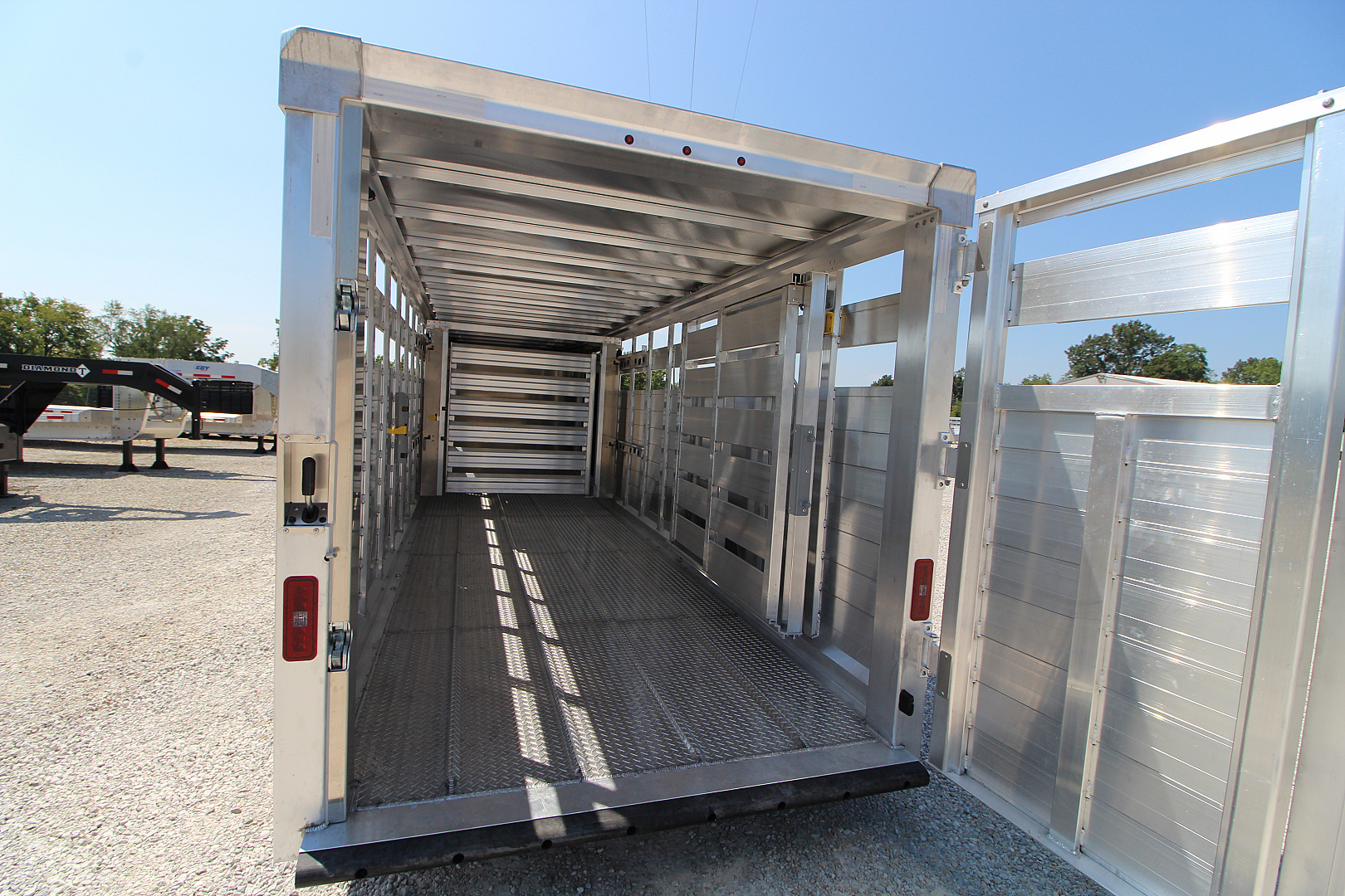 New 2026 EBY Trailers Maverick 6'11 x 24' Stock / Stock Combo Trailer