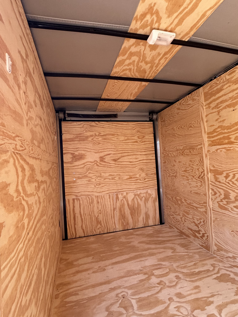 New 2025 Family Trailer 6x12 Tandem Axles Cargo / Enclosed Trailer- Screwless Exterior-Blackout pkg.-Rear Spoiler