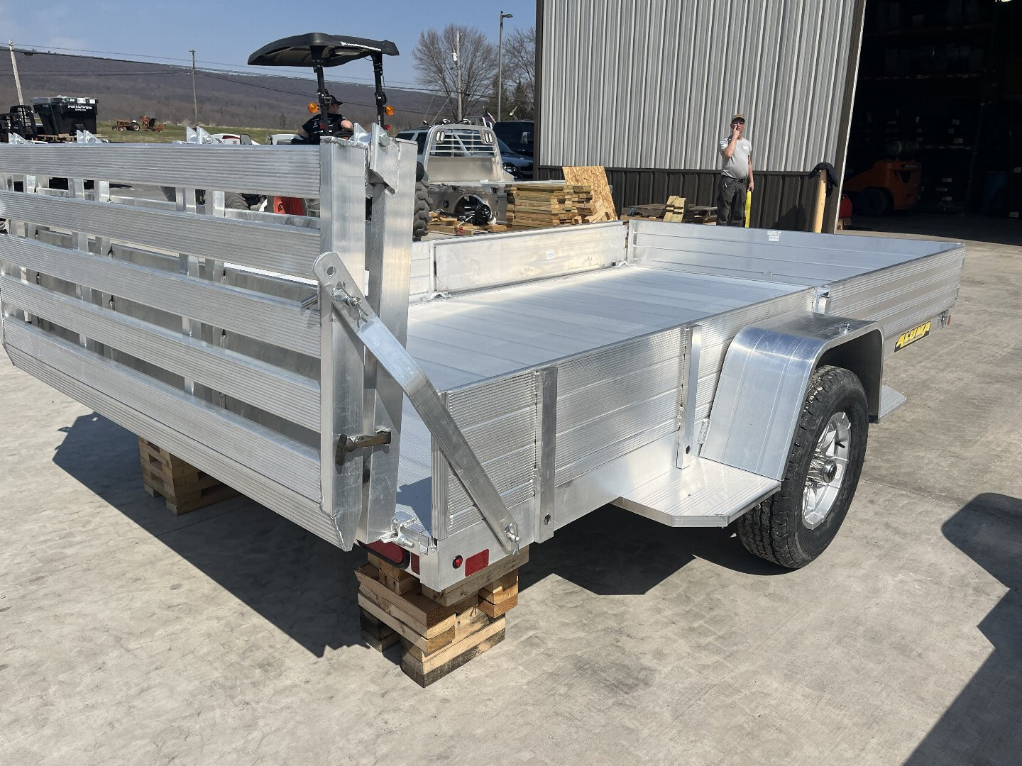 New 2026 Aluma 8112SR ATV/Utility Trailer - Solid Side w/ Side Load Ramps- Bi-Fold Gate