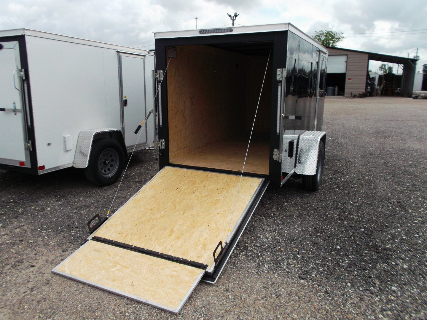 New 2026 Covered Wagon Trailers 5x10 Single Axle Cargo Trailer / Enclosed Cargo Trailer / Ramp / RV Side Door / Bed Lined Tongue and Frame / .030 Black Semi-Screwless Exterior