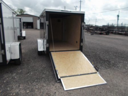 New 2026 Covered Wagon Trailers 5x10 Single Axle Cargo Trailer / Enclosed Cargo Trailer / Ramp / RV Side Door / Bed Lined Tongue and Frame / .030 Black Semi-Screwless Exterior