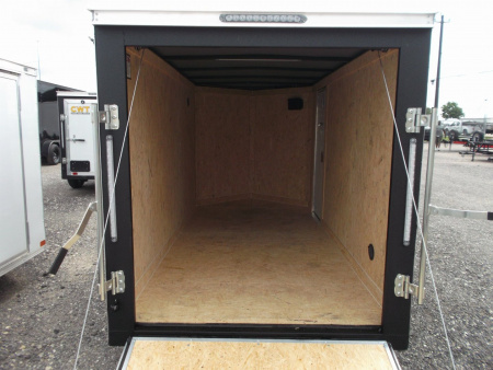 New 2026 Covered Wagon Trailers 5x10 Single Axle Cargo Trailer / Enclosed Cargo Trailer / Ramp / RV Side Door / Bed Lined Tongue and Frame / .030 Black Semi-Screwless Exterior