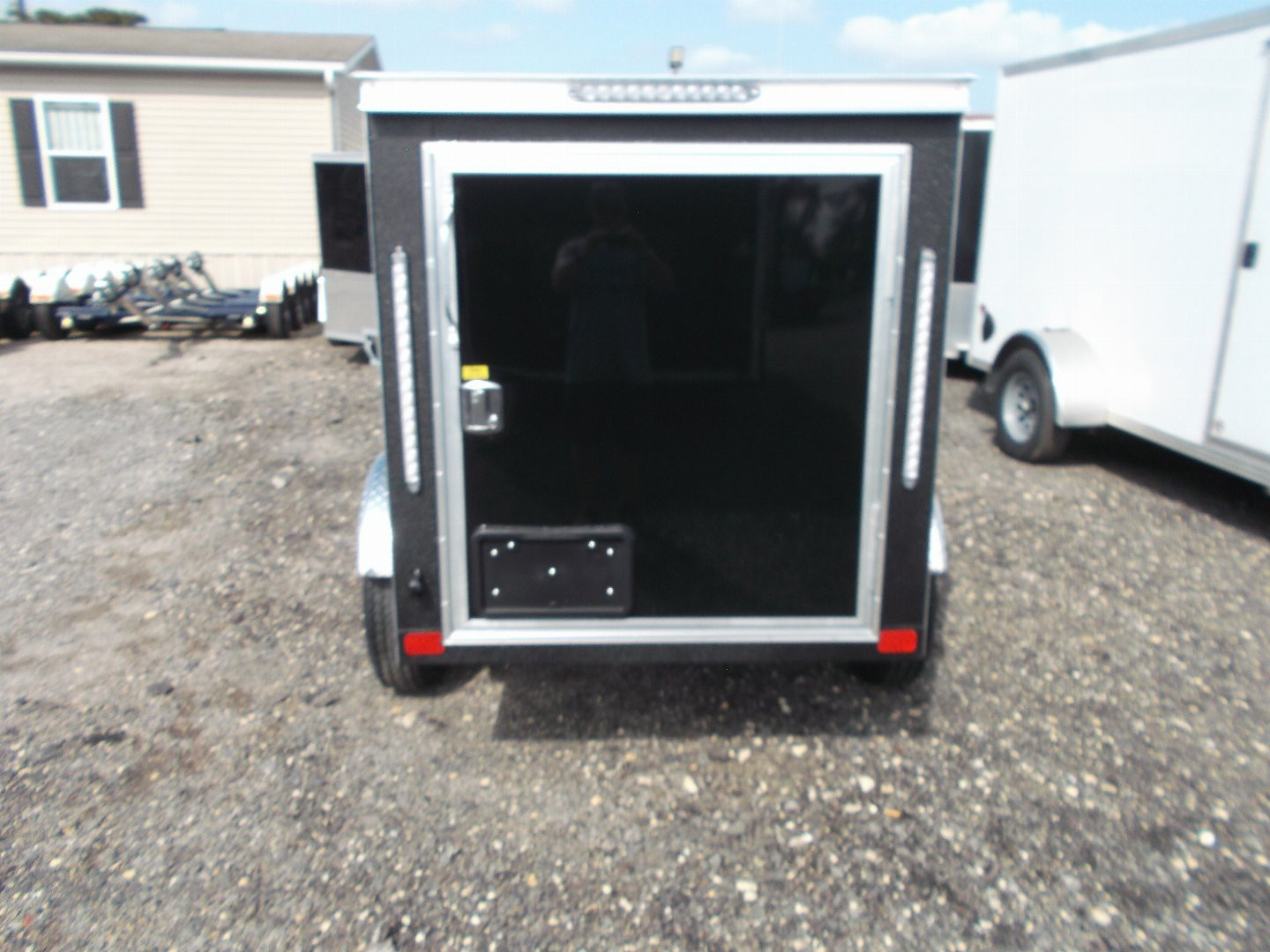 New 2026 Covered Wagon Trailers 4x6 Single Axle Cargo Trailer / Enclosed Trailer / LEDs / .030 Black Semi-Screwless Exterior / Bed Lined Frame and Tongue