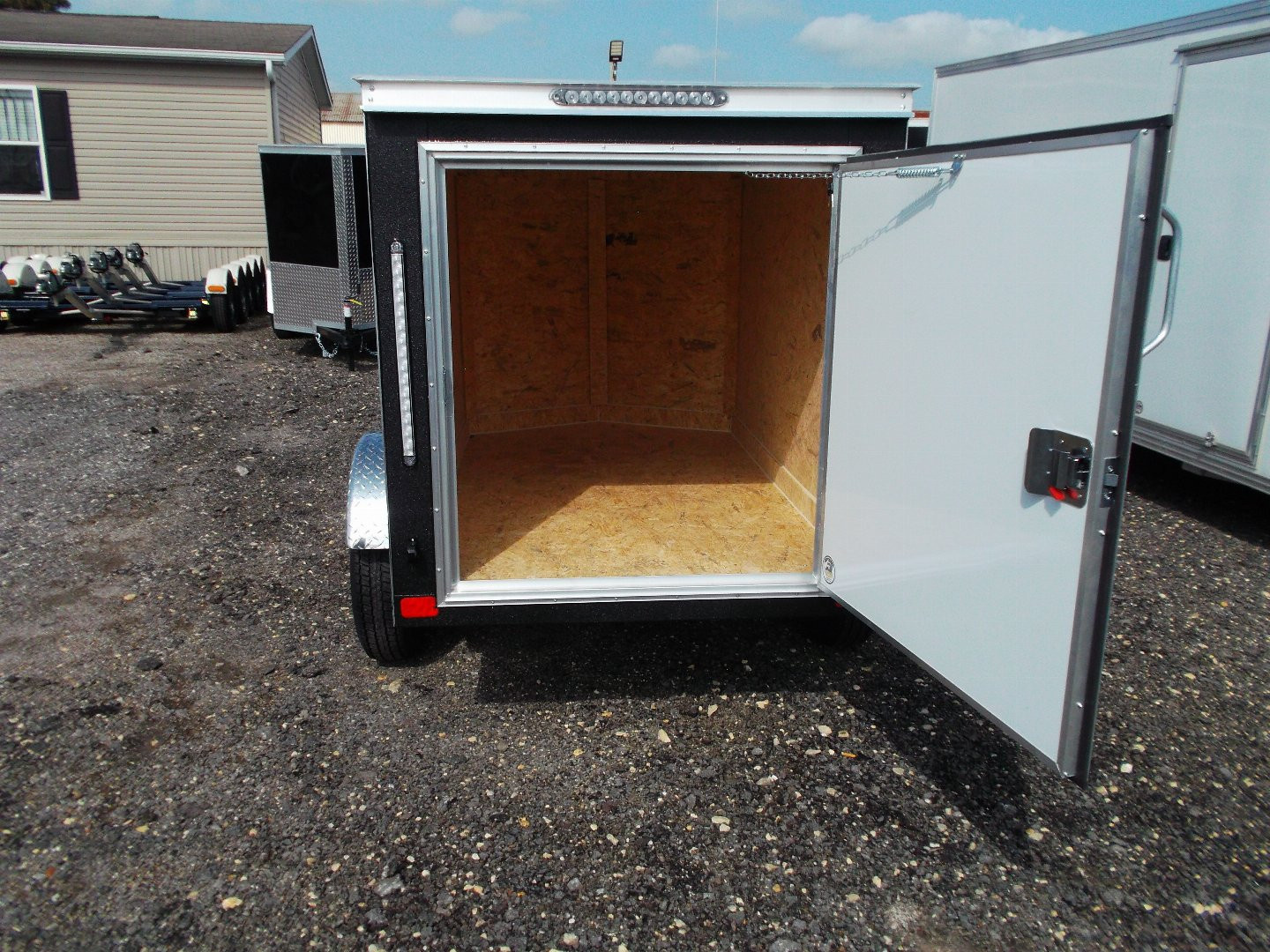 New 2026 Covered Wagon Trailers 4x6 Single Axle Cargo Trailer / Enclosed Trailer / LEDs / .030 Black Semi-Screwless Exterior / Bed Lined Frame and Tongue