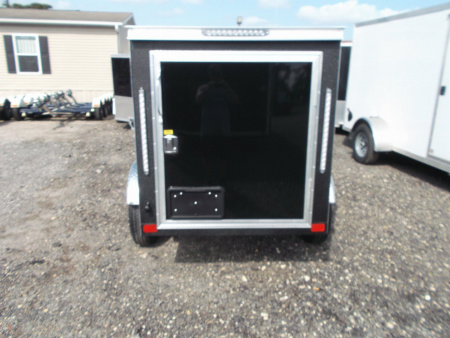 New 2026 Covered Wagon Trailers 4x6 Single Axle Cargo Trailer / Enclosed Trailer / LEDs / .030 Black Semi-Screwless Exterior / Bed Lined Frame and Tongue