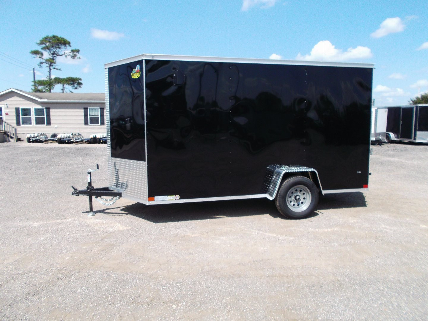 New 2026 Covered Wagon Trailers 6x12 Cargo / Enclosed Trailer / Extra Wide Ramp / 36" RV Side Door / 6'6" Interior / Bed Lined Tongue and Frame / (4) D-Rings / .030 Black Semi-Screwless Exterior