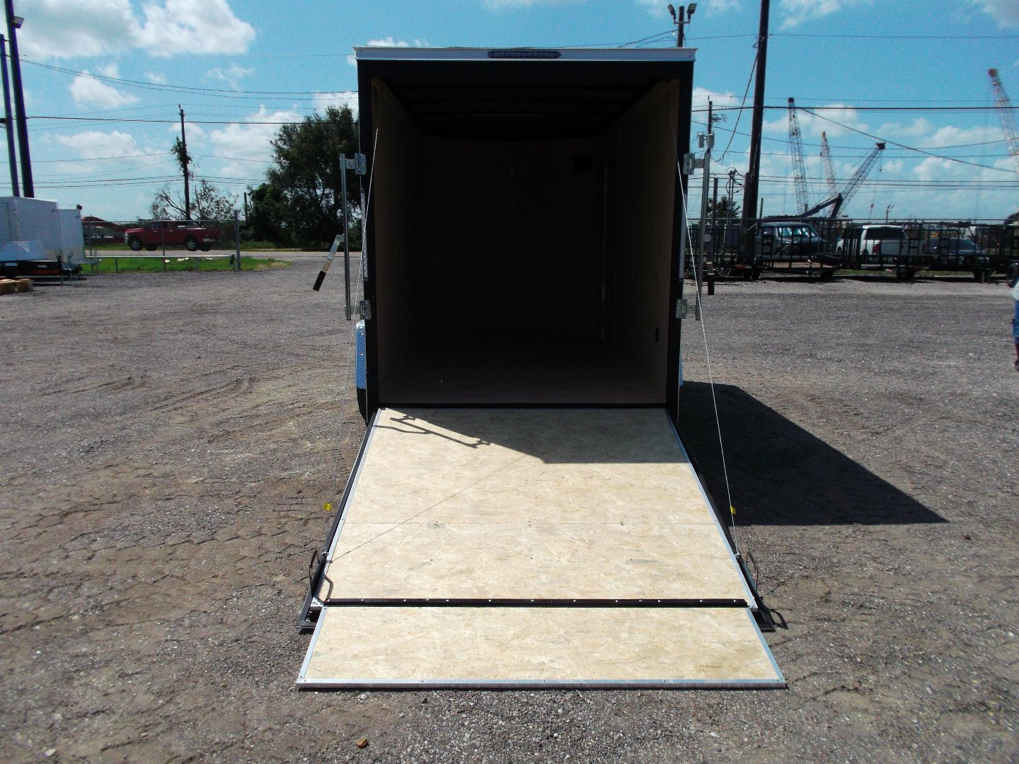 New 2026 Covered Wagon Trailers 6x12 Cargo / Enclosed Trailer / Extra Wide Ramp / 36" RV Side Door / 6'6" Interior / Bed Lined Tongue and Frame / (4) D-Rings / .030 Black Semi-Screwless Exterior