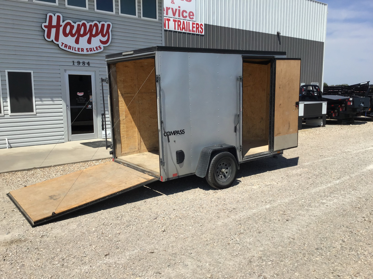 Used 2023 Compass 6'x10' Enclosed Trailer- Indigo