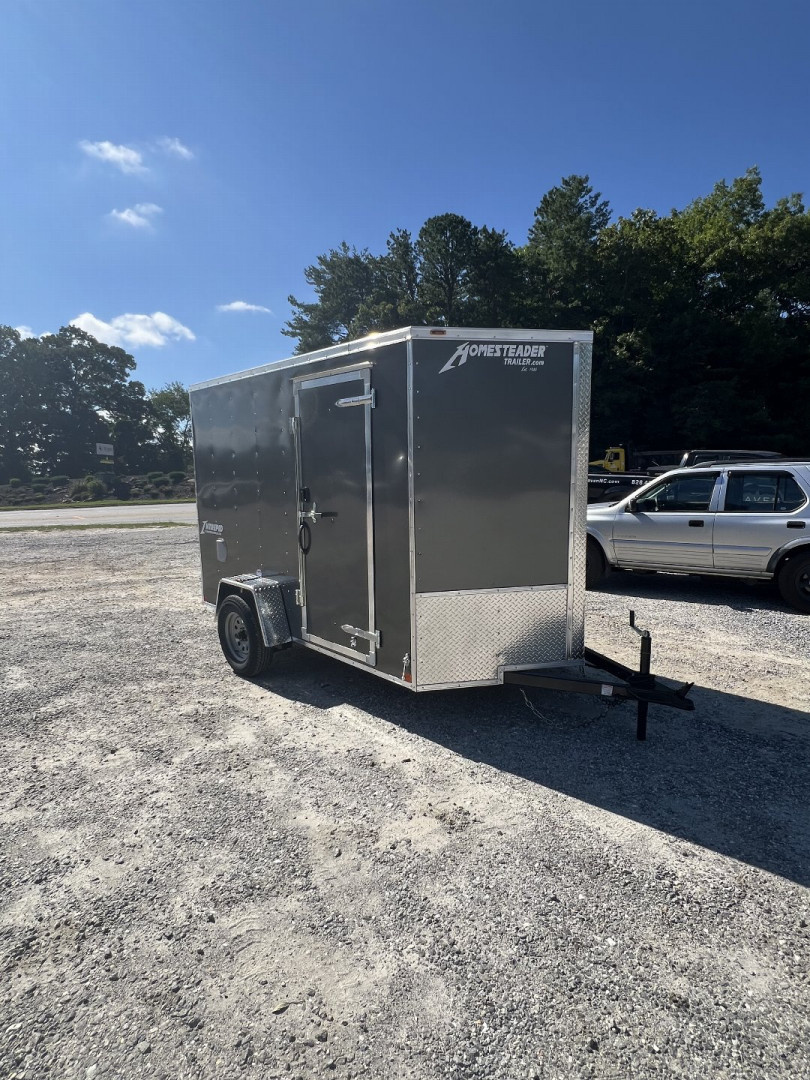 New 2025 Homesteader Trailer / 610IS Cargo / Enclosed Trailer / 6'6" Interior Height / Charcoal Gray in color / Side Door w/ RV Door Lock and Ramp Rear Door