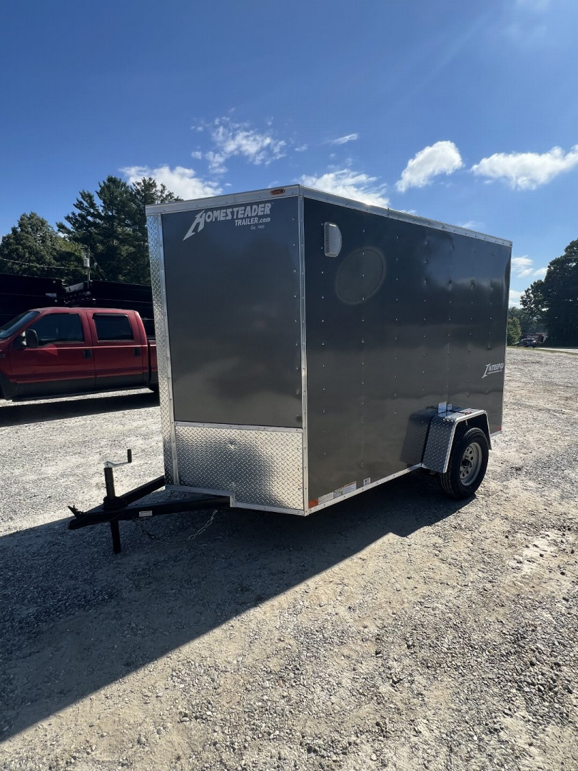 New 2025 Homesteader Trailer / 610IS Cargo / Enclosed Trailer / 6'6" Interior Height / Charcoal Gray in color / Side Door w/ RV Door Lock and Ramp Rear Door