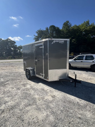 New 2025 Homesteader Trailer / 610IS Cargo / Enclosed Trailer / 6'6" Interior Height / Charcoal Gray in color / Side Door w/ RV Door Lock and Ramp Rear Door