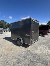 New 2025 Homesteader Trailer / 610IS Cargo / Enclosed Trailer / 6'6" Interior Height / Charcoal Gray in color / Side Door w/ RV Door Lock and Ramp Rear Door