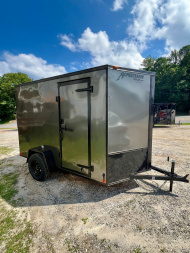 New 2026 HOMESTEADER TRAILER / INTREPID SERIES / 6' WIDE X 10' LONG / 6'6  INTERIOR HEIGHT / .030 CHARCOAL GRAY ALUMINUM W/ BLACK OUT PKG / 32  SIDE DOOR W/ RV LOCK / RAMP REAR DOOR / 4-D RINGS / 16  O/C WALL POST