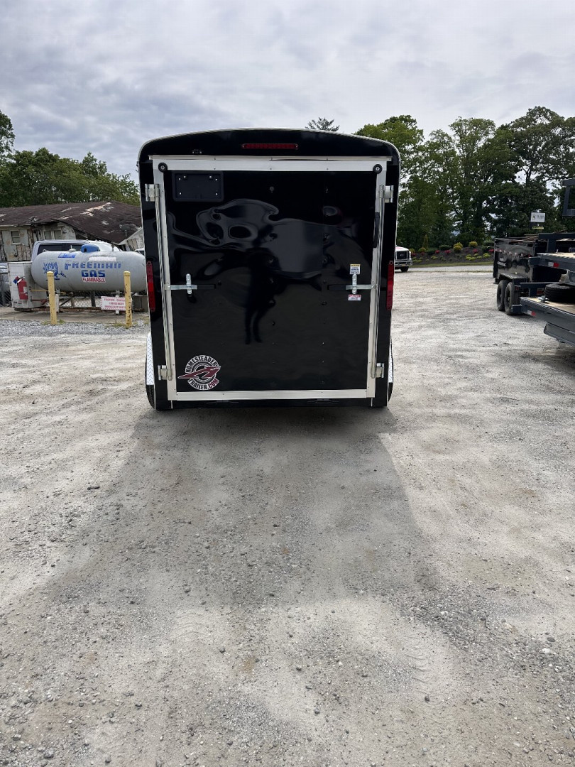 New 2025 Homesteader Trailer 610CS Cargo / Enclosed Trailer / 6x10 / Black in color / Ramp Rear Door / 32" Side Door / 4- Recessed D-Rings / 73" Interior Height