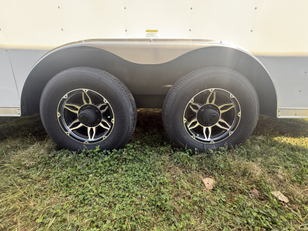 New RC Trailers 8.5x25 10k snow/car hauler,torsion axles with alum. Wheels,5' wedge nose,30 amp sevice with cord,12 volt battery,4' caninet,2 windows an fuel doors, round top