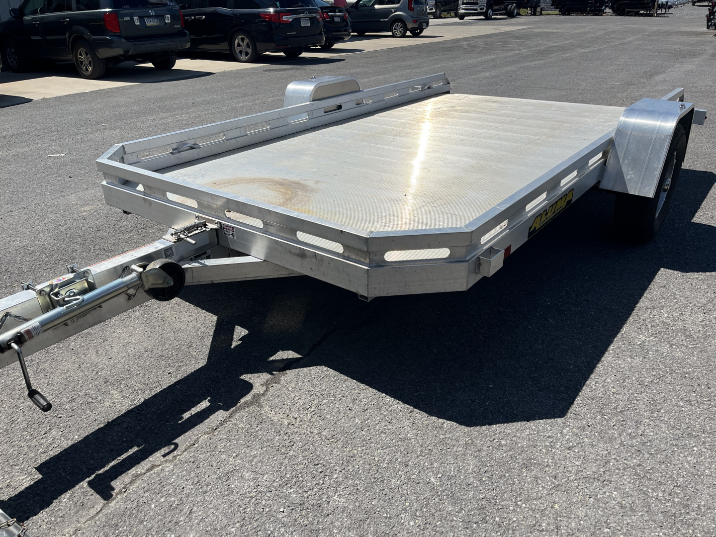 Used 2025 USED Aluma 7712H Tilt Utility Trailer