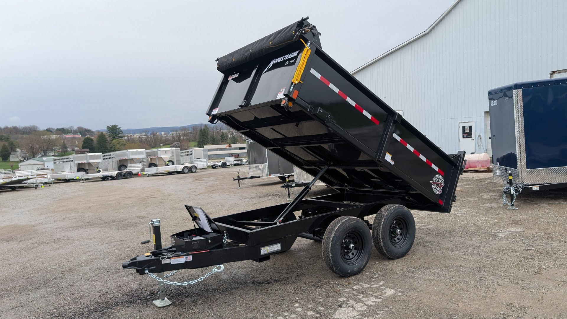 New 2026 Homesteader 6x10 Deckover Dump Trailer w/ Dropside on Curbside & Barn Doors