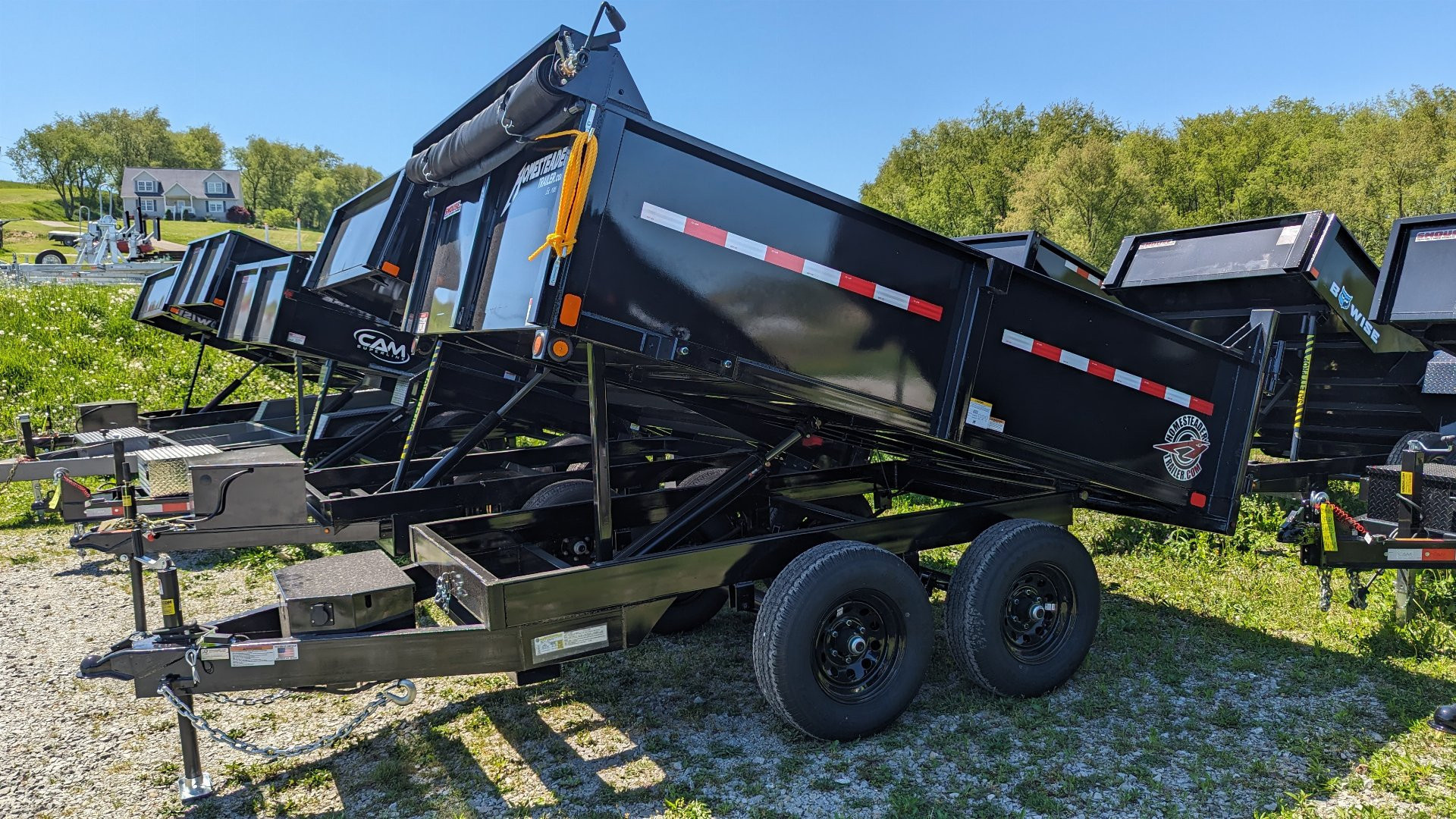 New 2026 Homesteader 6x12 Deckover Dump Trailer w/ Dropside on Curbside