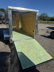 New 2026 Arising 5X8 SINGLE AXLE 2990 LB GVWR Cargo / Enclosed Trailer WITH 5FT INTERIOR HEIGHT, REAR RAMP DOOR, FULL TUBE FRAME, COMPOSITE .080 EXTERIOR, 2 SIDE VENTS AND SHORT ENOUGH TO FIT INSIDE YOUR GARAGE!.