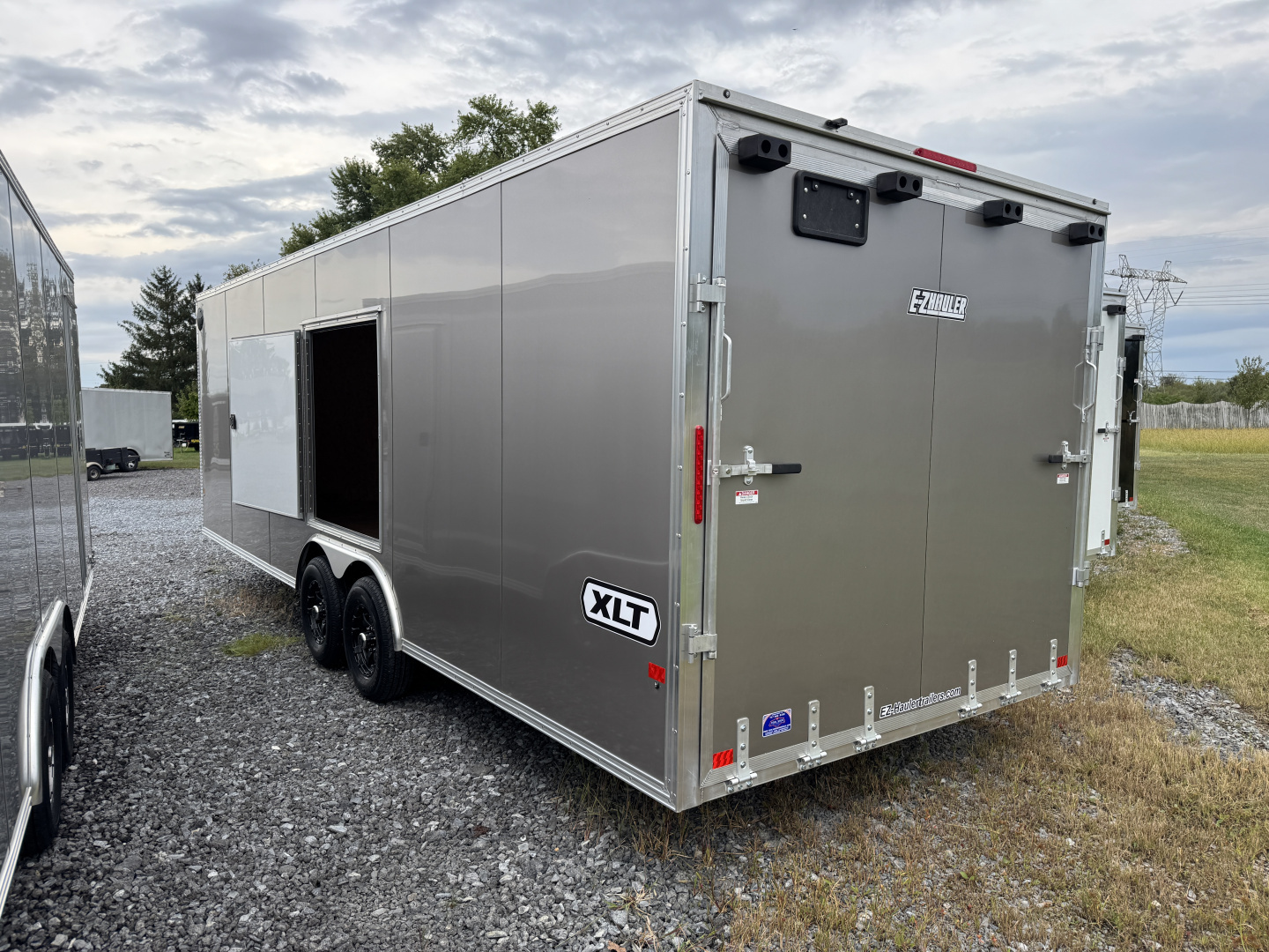 New 2026 E-Z Hauler 8.5x24 XLT Pro 10k Car Hauler Side Escape Door