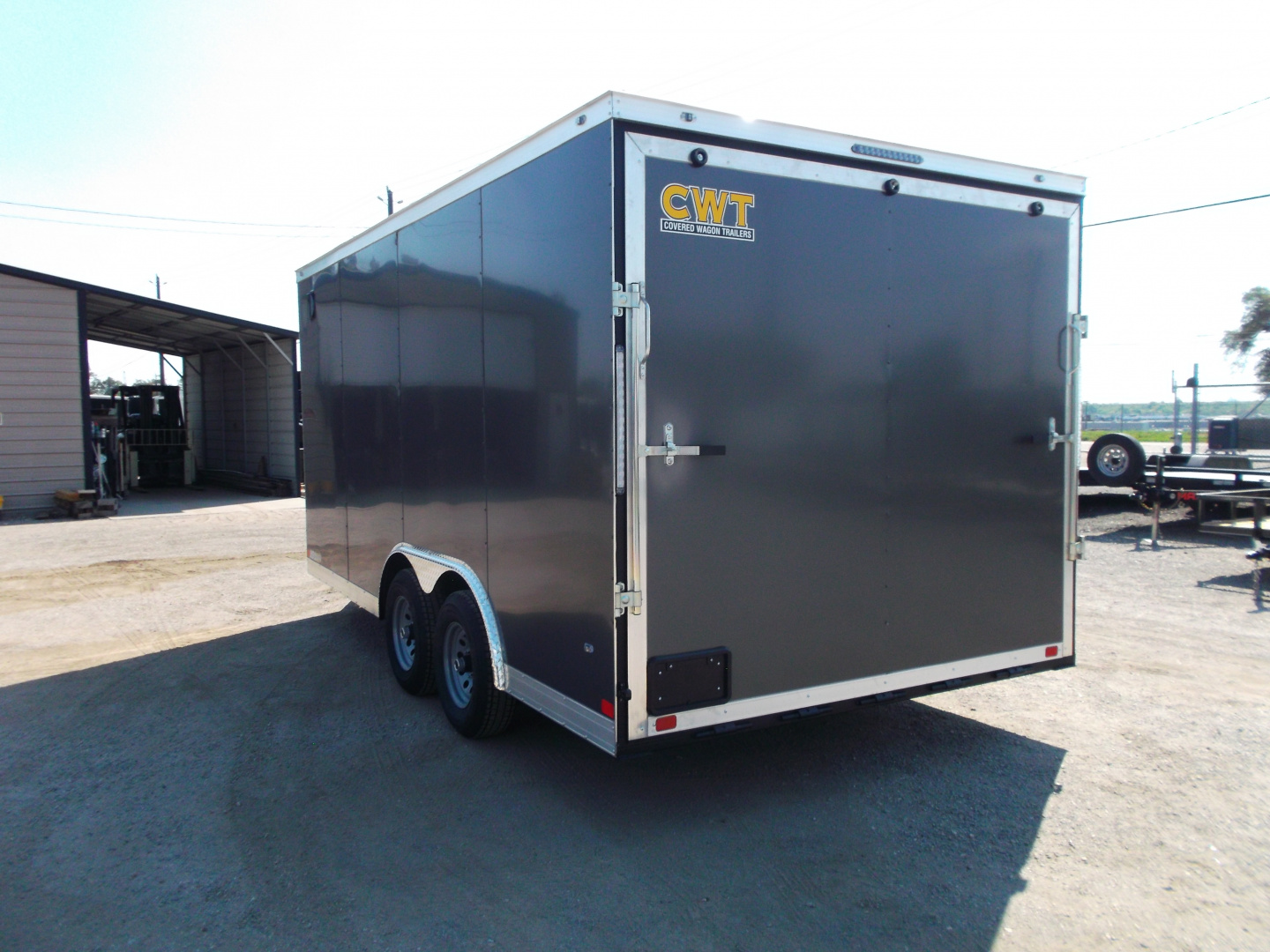 New 2026 Covered Wagon Trailers 8.5x16 Cargo Trailer / Car Hauler / 5200# Axles / 7ft Interior Height / 48" RV Side Door / .080 Charcoal Gray Poly Core Semi-Screwless Exterior / 60" Triple Tube Tongue / Extra Wide Ramp