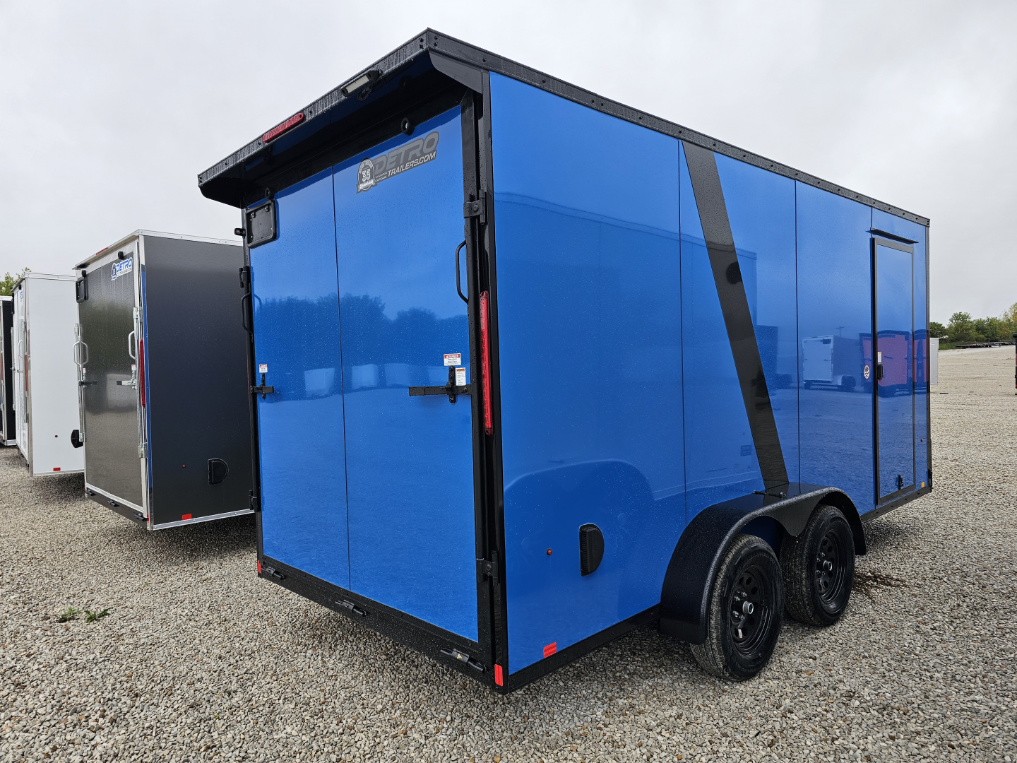 New 2026 "True Blue"/Blackout Cargo Express EX DLX 7' x 16' 7K Ramp Door Cargo / Enclosed Trailer