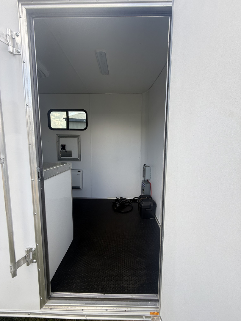 New 2025 Team Spirit Trailers 6x10 fiber trailer screwless,Insulated walls 110 package with 30 amp cord 12 volt charger 13.5 AC toolbox ext toing 2 fiber doors spare tire mount with spare tire 12 volt LED light on ceiling Fiber Splicing