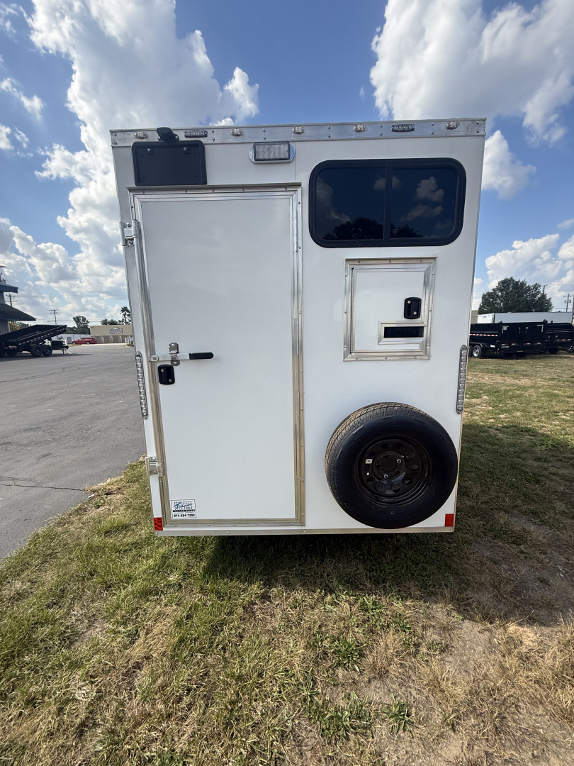 New 2025 Team Spirit Trailers 6x10 fiber trailer screwless,Insulated walls 110 package with 30 amp cord 12 volt charger 13.5 AC toolbox ext toing 2 fiber doors spare tire mount with spare tire 12 volt LED light on ceiling Fiber Splicing