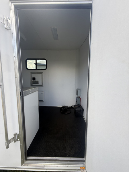 New 2025 Team Spirit Trailers 6x10 fiber trailer screwless,Insulated walls 110 package with 30 amp cord 12 volt charger 13.5 AC toolbox ext toing 2 fiber doors spare tire mount with spare tire 12 volt LED light on ceiling Fiber Splicing