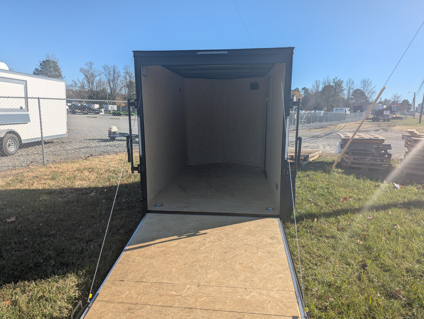 New 2025 Covered Wagon Trailers 6x10 Gold Series w/ Rear Ramp & Black Out Pkg Cargo / Enclosed Trailer