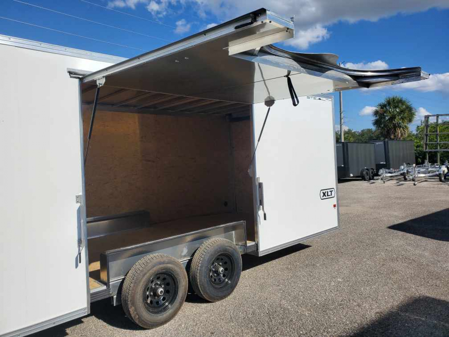 New 2026 ALCOM 8.5X24 TANDEM AXLE 9990 LB GVWR ALUMINUM ENCLOSED Car / Racing Trailer WITH AWESOME 8FT WIDE ESCAPE DOOR, REMOVEABLE INNER FENDER WELL, 6'9" INTERIOR HEIGHT, V NOSE, REAR RAMP DOOR, 1 PIECE ALUMINUM ROOF