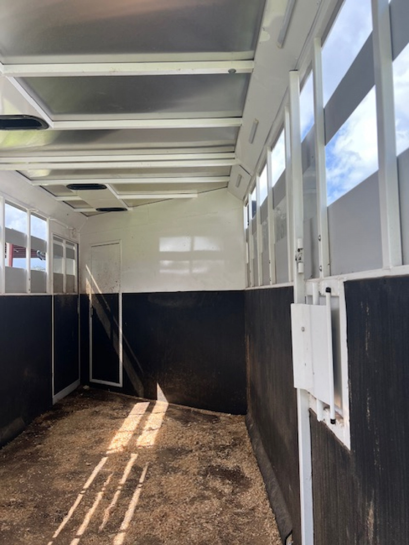 Used 2023 Trails West Santa Fe 12'lq w/midtack and stock area Stock / Stock Combo Trailer