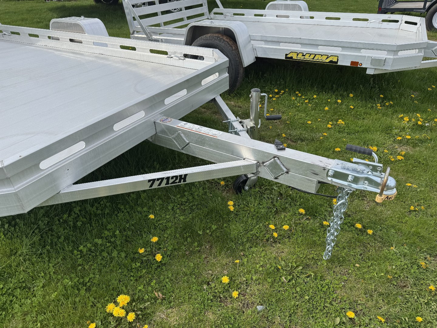 New 2026 Aluma 7712H-S-TG One Piece Gate Utility Trailer