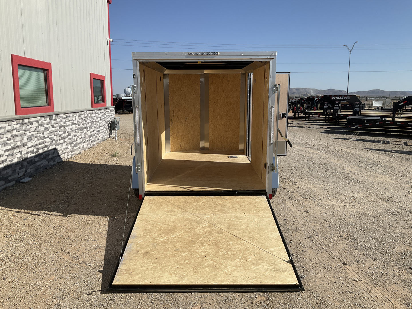 New 2026 Compass 6'x10' Enclosed Cargo Trailer - Indigo DLX