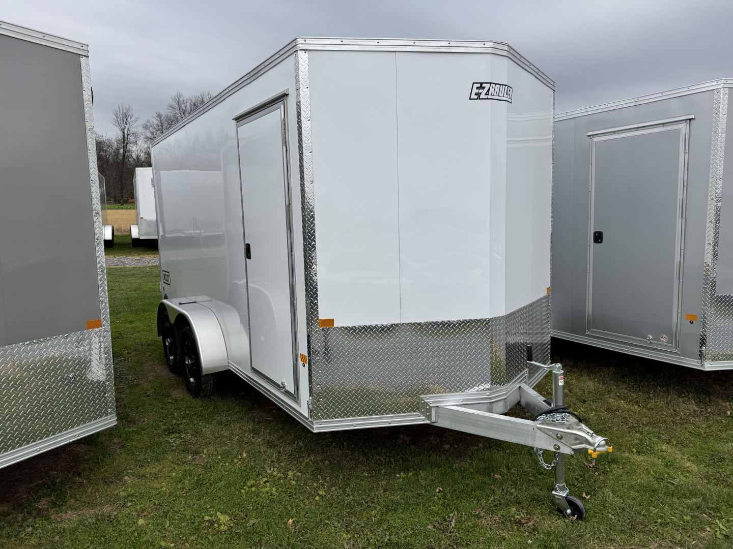 7x16 New 2026 E-Z Hauler XLT PRO 7x16 Tandem Axle Enclosed 6'9