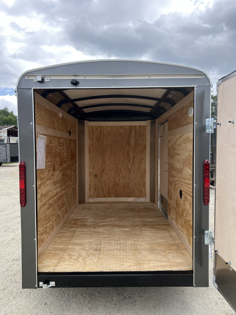 New 2026 Homesteader Trailer / Challenger Series / 5x8 / 5'7" Interior Height / Single Swing Rear Door / 32" Side Door / 24" Stoneguard / .030 Charcoal Gray Aluminum