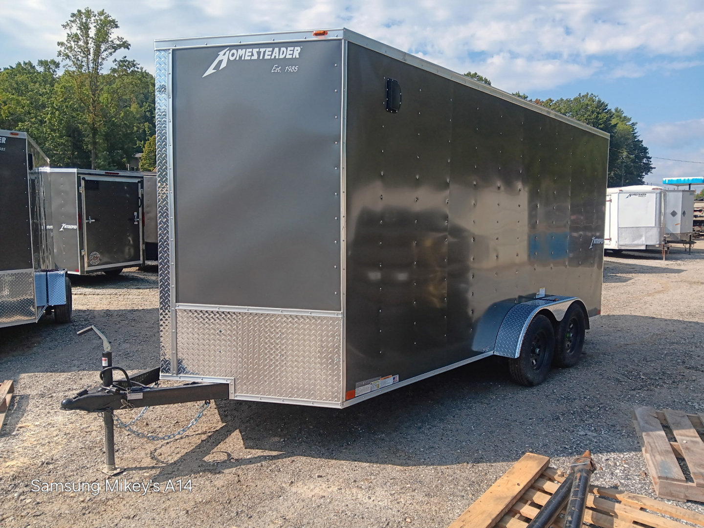 New 2026 HOMESTEADER CARGO TRAILER / INTREPID SERIES / 7'X16' / 7' INTERIOR HEIGHT / 32" SIDE DOOR W/ RV LOCK / RAMPS REAR DOOR / .030 CHARCOAL GRAY ALUMINUM
