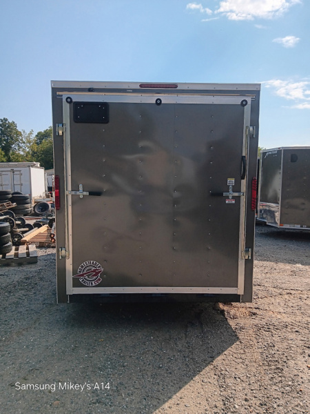 New 2026 HOMESTEADER CARGO TRAILER / INTREPID SERIES / 7'X16' / 7' INTERIOR HEIGHT / 32" SIDE DOOR W/ RV LOCK / RAMPS REAR DOOR / .030 CHARCOAL GRAY ALUMINUM