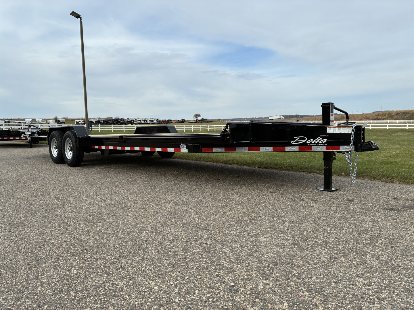 New 2026 Delta 27TB Bumper Pull Tilt 24' Flatbed Trailer