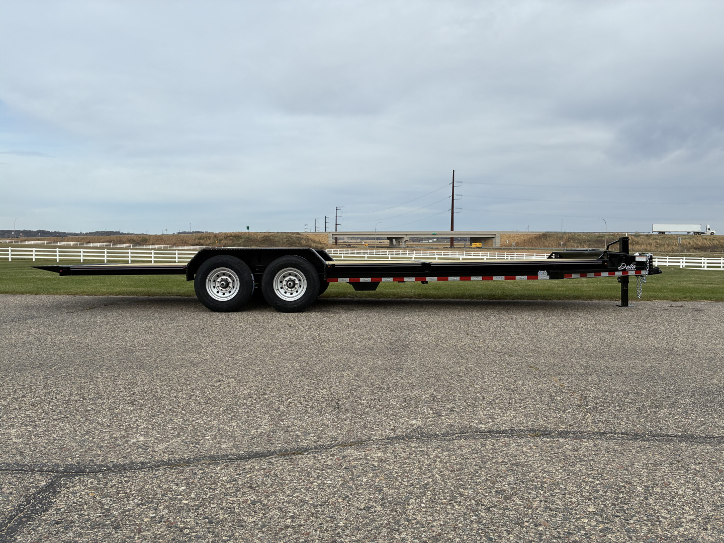 New 2026 Delta 27TB Bumper Pull Tilt 24' Flatbed Trailer
