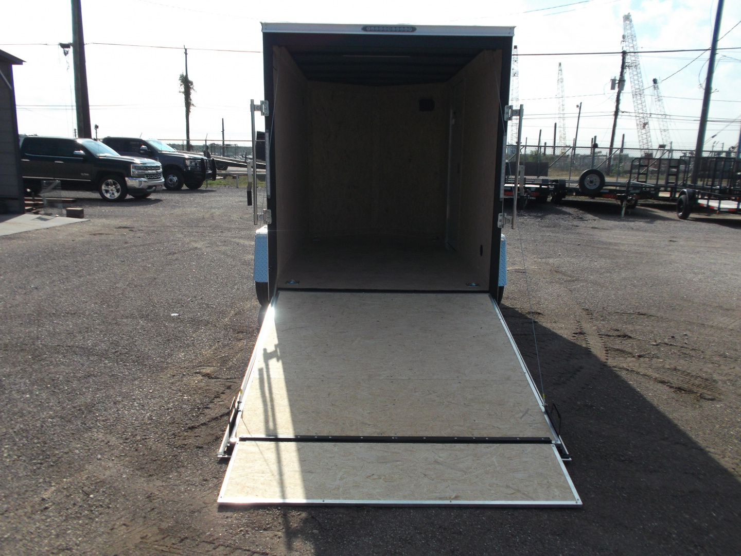 New 2026 Covered Wagon Trailers 6x10 Cargo / Enclosed Trailer / 6'6" Interior Height / Extra Wide Ramp Gate / RV Side Door /.030 Black Semi-Screwless Exterior