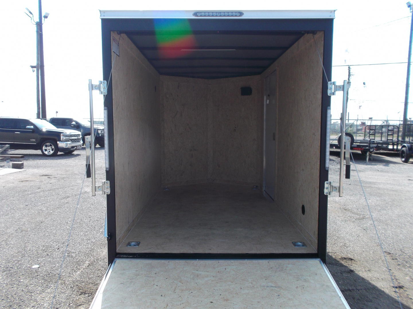 New 2026 Covered Wagon Trailers 6x10 Cargo / Enclosed Trailer / 6'6" Interior Height / Extra Wide Ramp Gate / RV Side Door /.030 Black Semi-Screwless Exterior