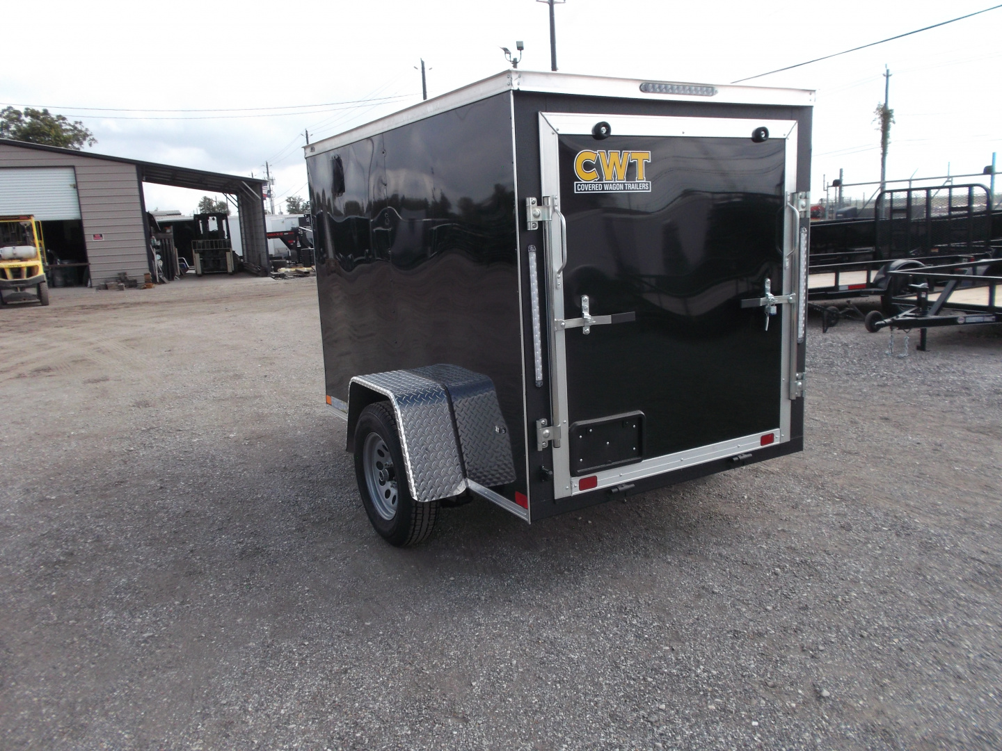 New 2026 Covered Wagon Trailers 5x8 Single Axle Cargo Trailer / Enclosed Trailer / Ramp / LED's / .030 Black Semi-Screwless Exterior / Bed Lined Tongue and Frame