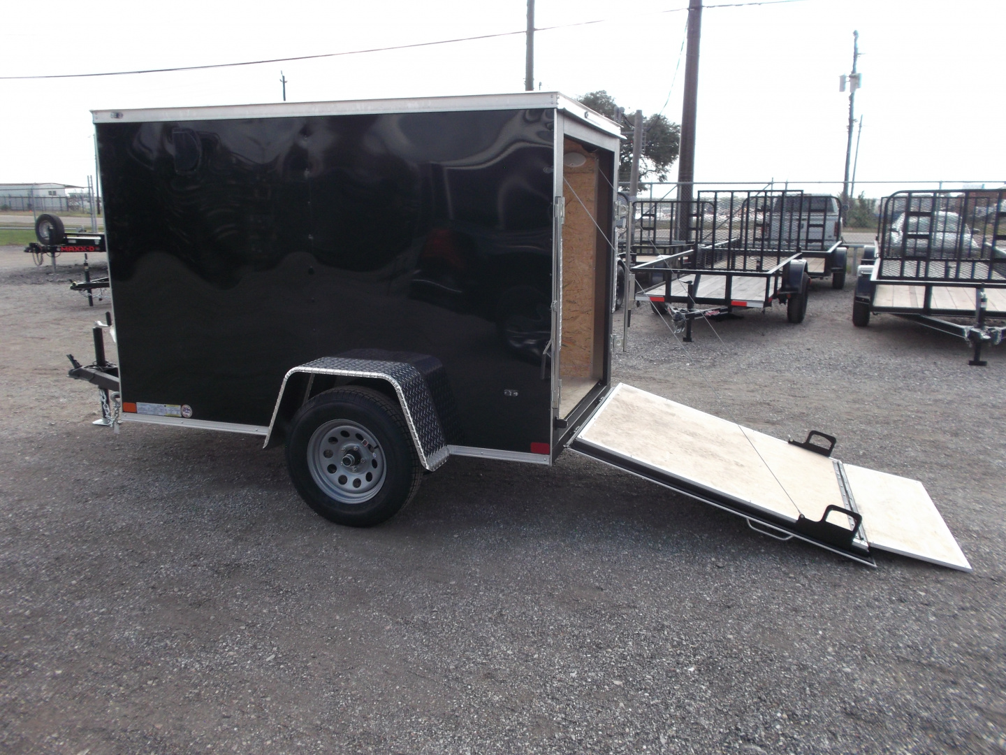 New 2026 Covered Wagon Trailers 5x8 Single Axle Cargo Trailer / Enclosed Trailer / Ramp / LED's / .030 Black Semi-Screwless Exterior / Bed Lined Tongue and Frame